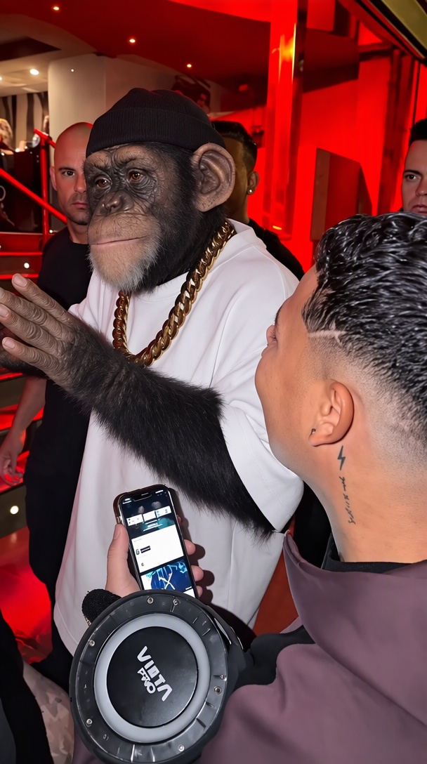 Chimp character performing in the red-lit freestyle scene